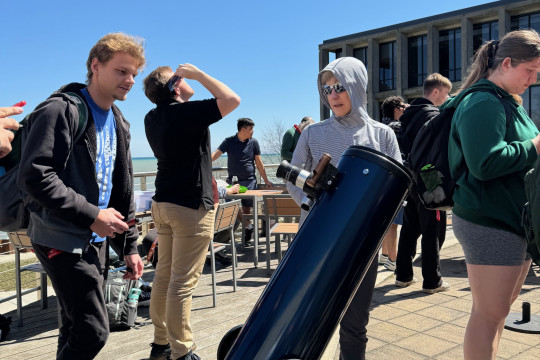 The Physics Department sets up a telescope for students during the solar eclipse on April 8.
