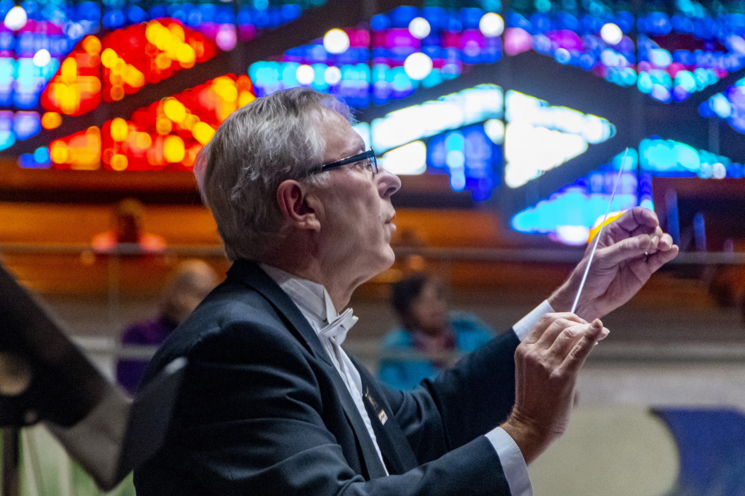 Carthage music professor Jim Ripley conducts the Carthage Wind Orchestra in the A. F. Siebert Chapel.