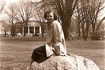 Kathleen (Peterson) Bradley is shown sitting on Kissing Rock at the Illinois campus, where she an...