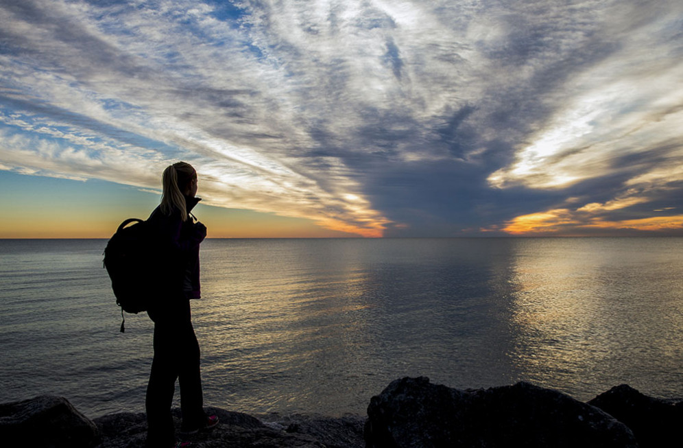 A student takes in the view of Lake Michigan.