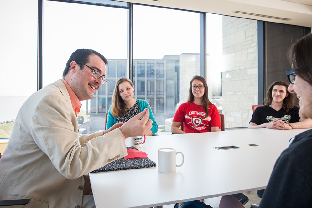 Prof. Anthony Barnhart shows his class some magic tricks during his on-campus J-Term course.