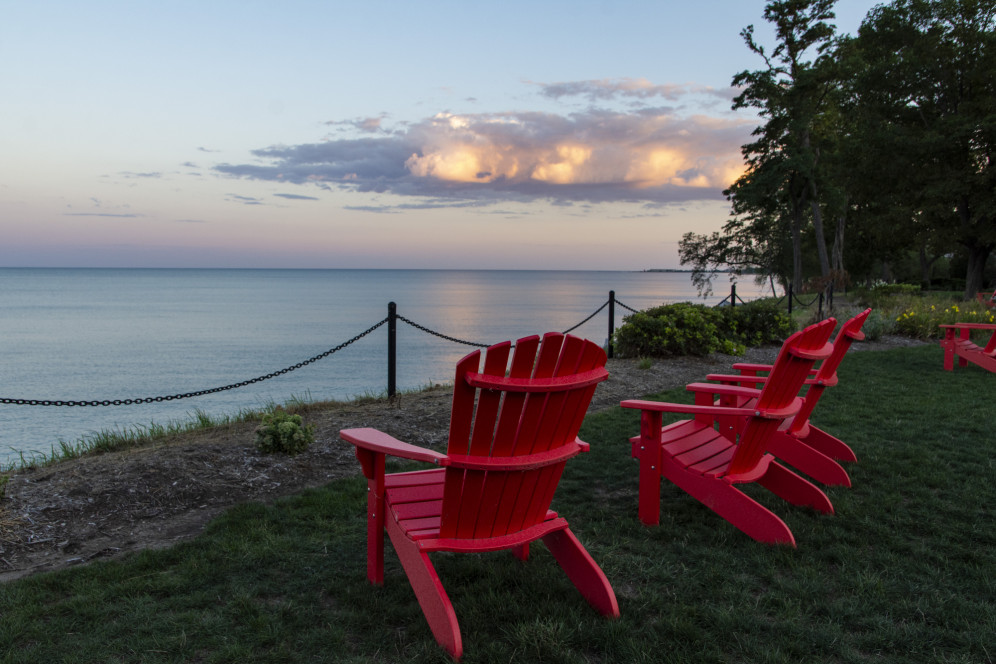 Red chairs along Lake Michigan