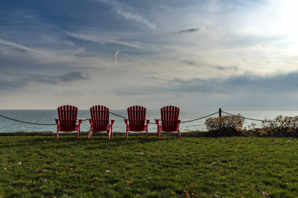 Red chairs along Lake Michigan