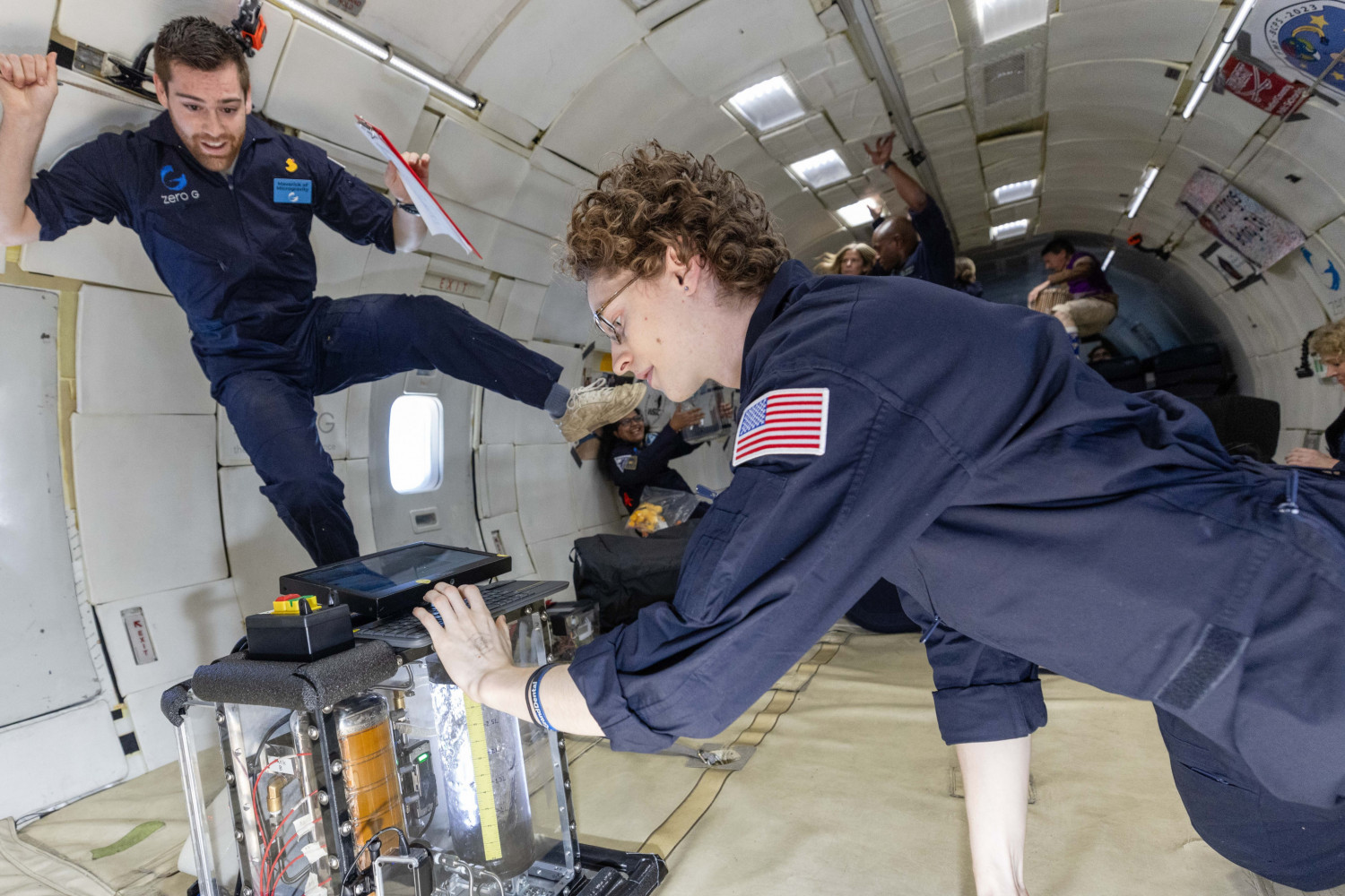 Carthage space science students testing their experiment on a zero-g flight.