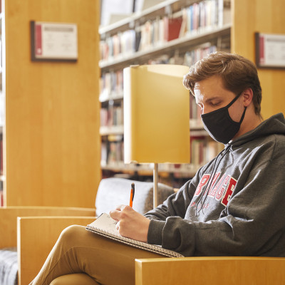 A student studies in the Hedberg Library.