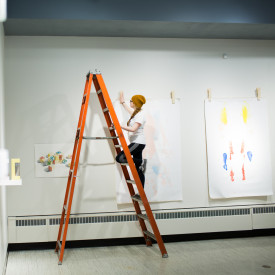 A gallery assistant builds an exhibition in the H. F. Gallery of Art.