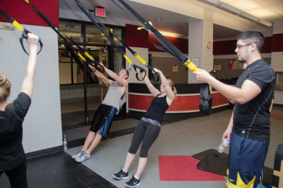 Students use the TRX Suspension Trainer in the TARC's Semler Fitness Center in January 2014. TRX ...