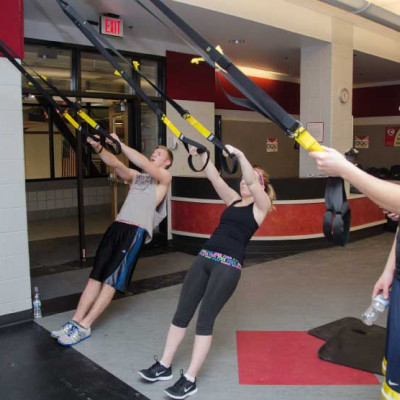 Students use the TRX Suspension Trainer in the TARC?s Semler Fitness Center in January 2014. TRX ...