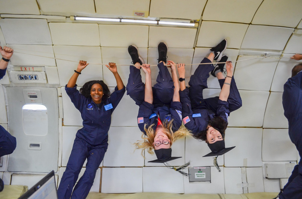 Students float upside down during their zero-g flight.