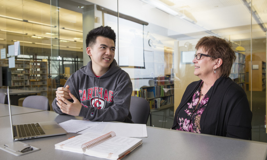An international student meets with faculty member Jean Preston.
