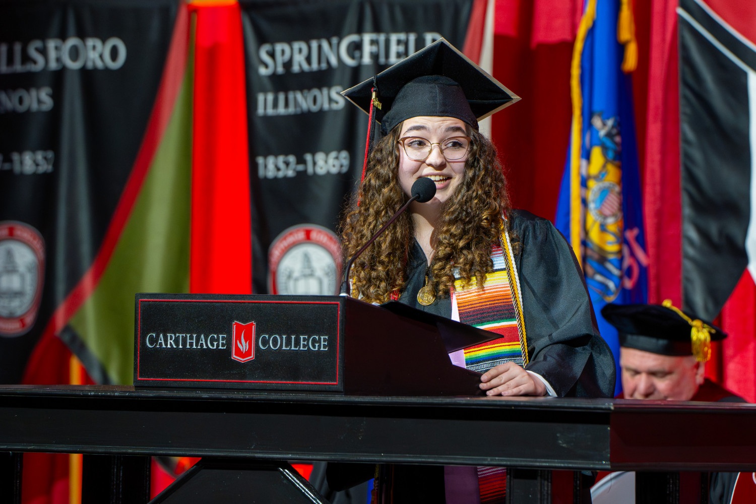 2024 Distinguished Senior, Grace Chapa ?24, speaking during the Commencement Ceremony.