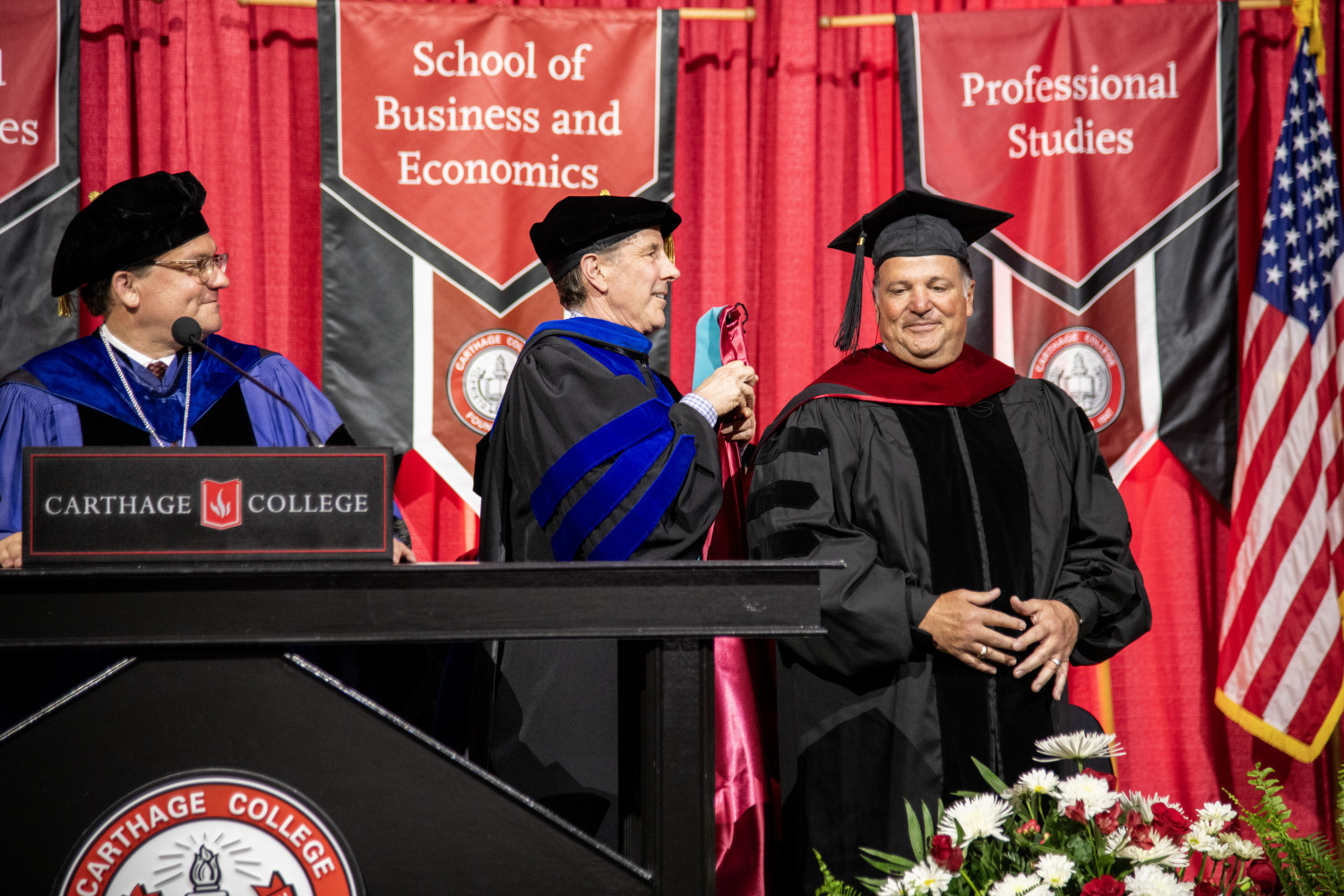 Aldo Madriagano receiving an honorary Doctor of Public Service degree.