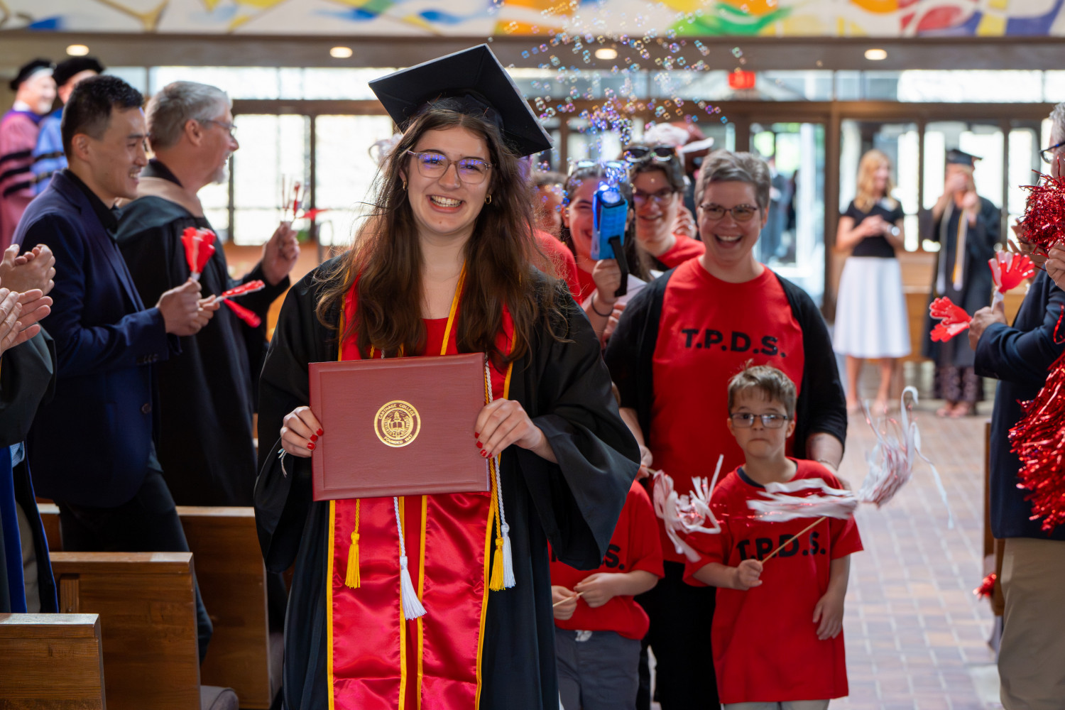 Students were cheered on by faculty in their department after they received their diplomas.