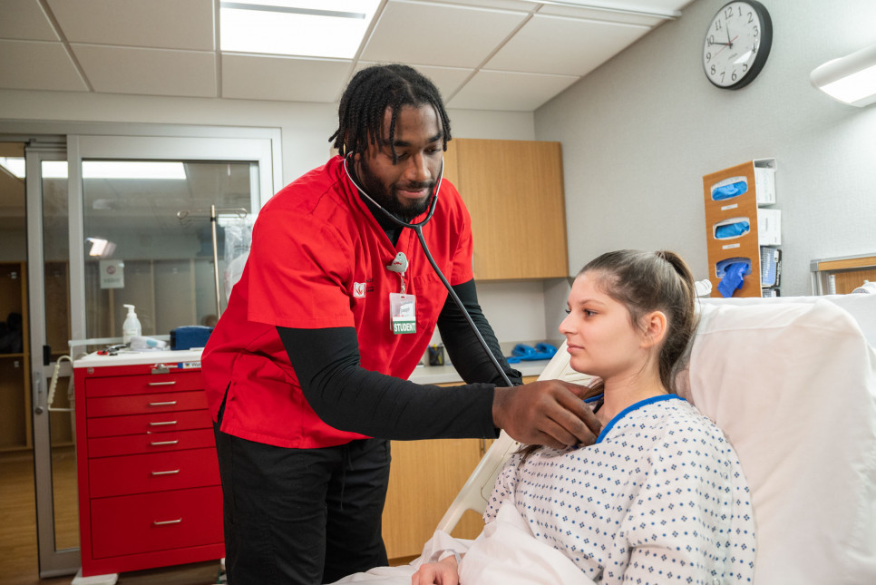Nursing student Joseph White '24 practices skills in the simulation lab on the Carthage College c...