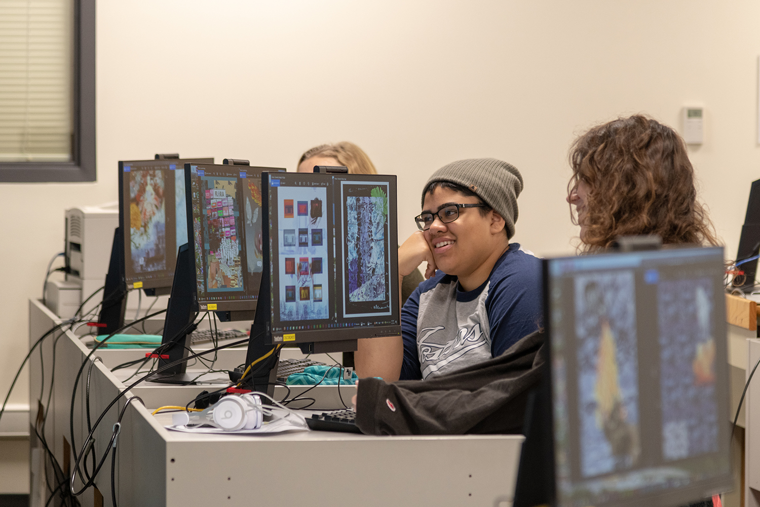 Foundations students critiquing artwork in computer lab. (Fall 2018)