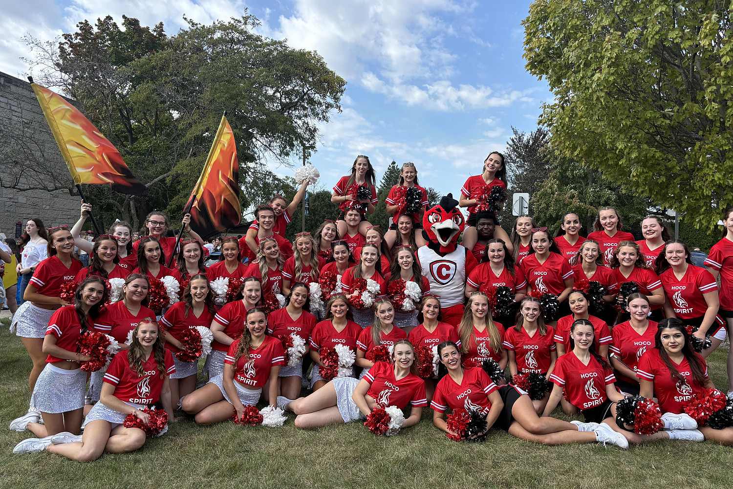 Members of the spirit team with Ember, the Firebird mascot.