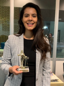 Maham Ali ?19 with her award from the Mock Trial tournament at Loras College in Jan. 2019.