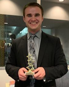 Joshua Kundert '19 with his award from the Mock Trial tournament at Loras College in Jan. 201...