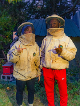 Carthage students dressed in protective bee suits.