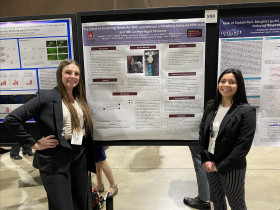 Hannah Poff ?24 (left) and Kate Talens ?24 (right) presenting one of three posters at the America...