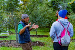 Curzio Caravati took students on a tour of the Swiss Bee Chalet and his local orchard.