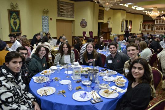 Carthage students participating in an iftar (breaking of the fast) dinner at the Turkish American...