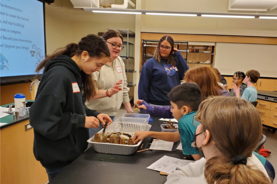 Students in the Case Studies in Environmental Science course teach local sixth graders about stra...