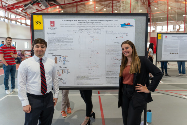 Students presenting their poster at the 2024 Celebration of Scholars Poster Exhibition.