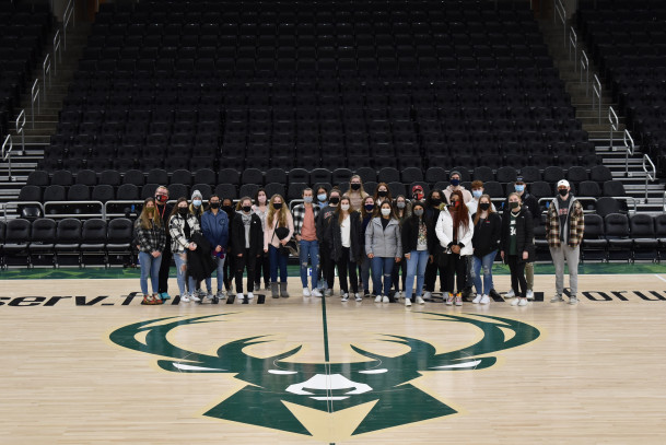 Students on the Milwaukee Bucks court.