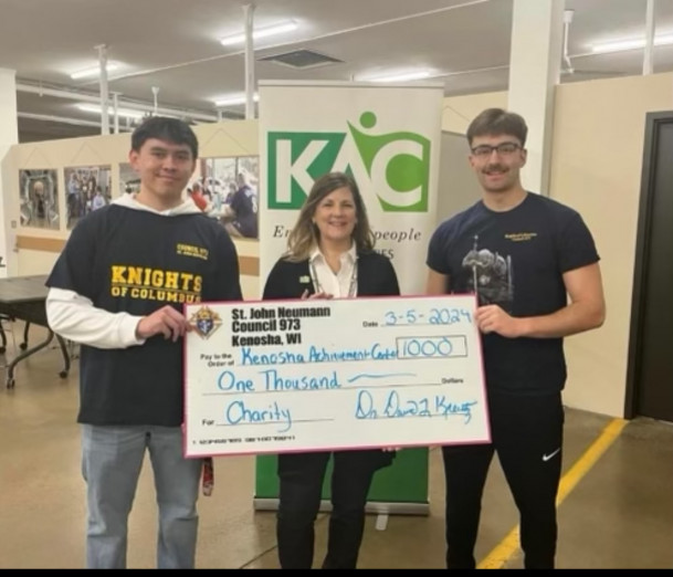 The Round Table Council donated $1,000 to the Kenosha Achievement Center. Kevin Lagunas ?24 (left...