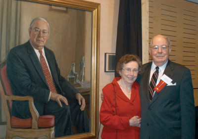 A. W. ?Tom? Clausen and his wife, Helen, stand next to a portrait of Mr. Clausen during the Octob...