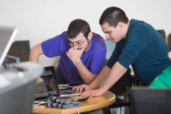 Students working on a computer science project.