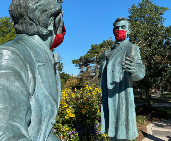 The Lincoln-Hayes statue dressed in masks.