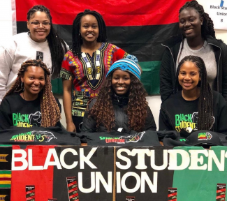 Students at a booth for the Black Student Union
