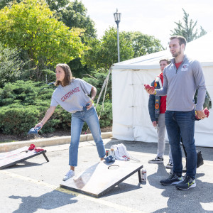 Carthage students play a game of Cornhole.