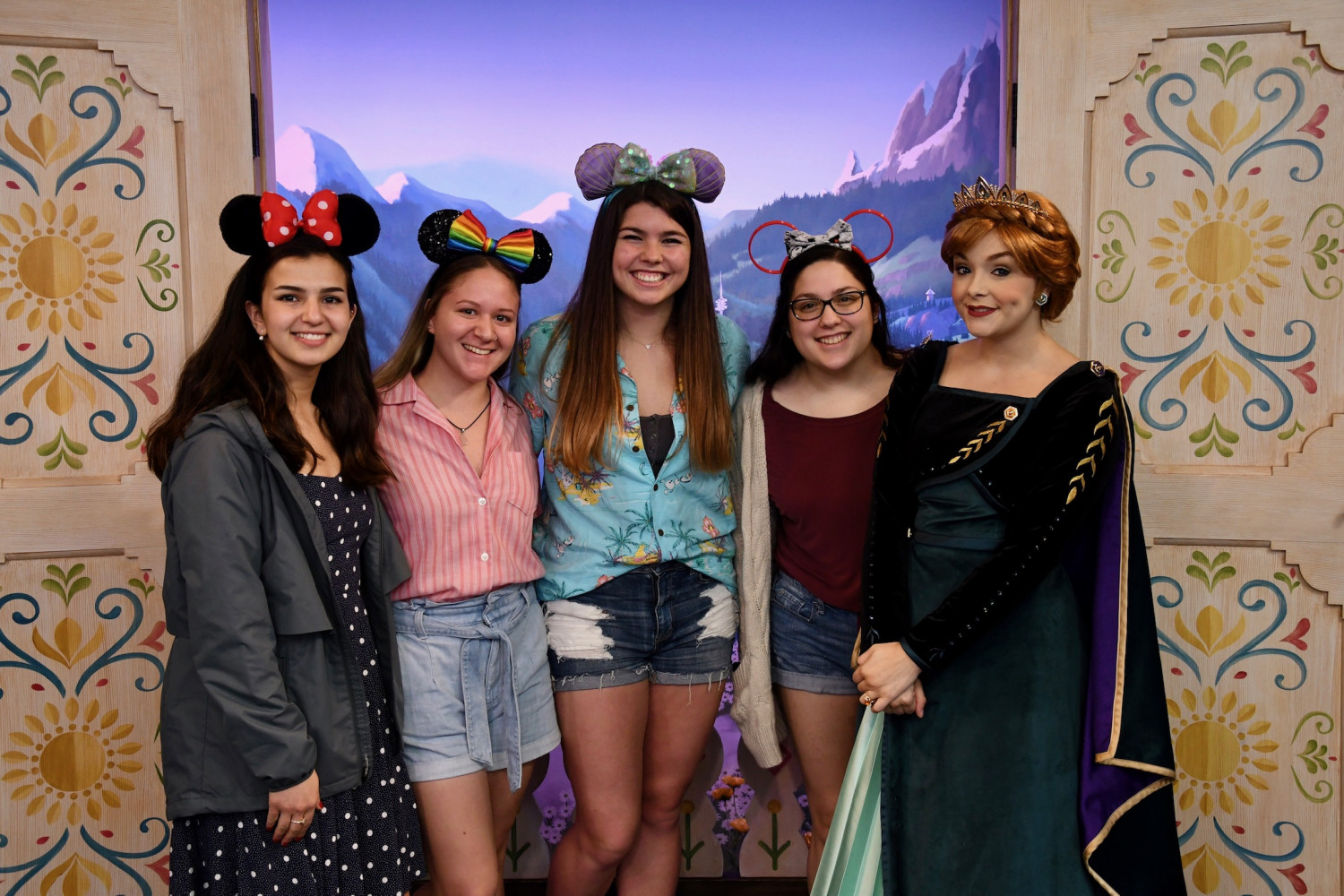 Students pose with a Disney princess during J-Term.