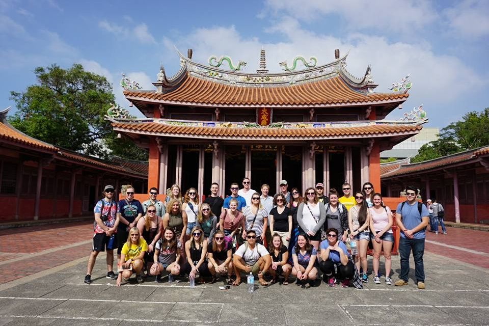 A group photo taken at a temple