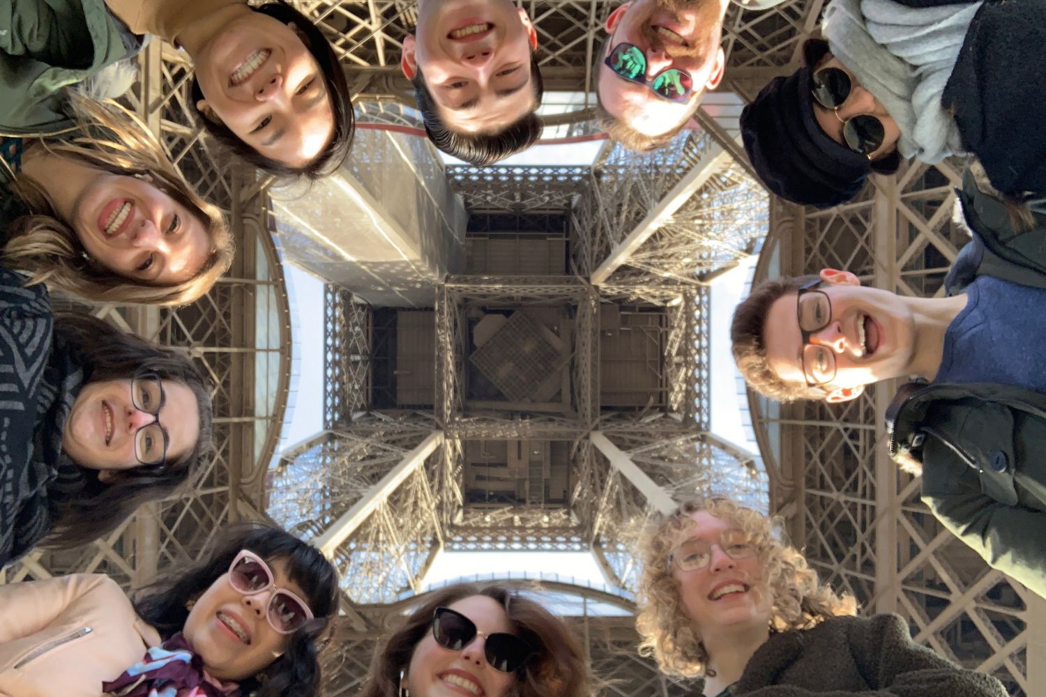 Students pose at the Eiffel Tower in Paris.