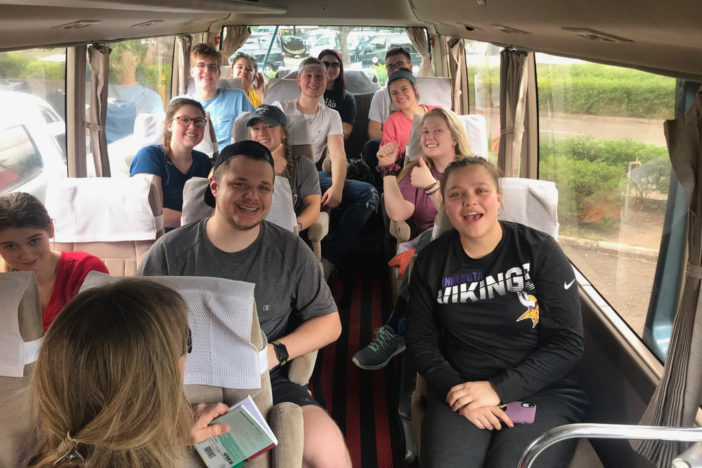 Students on a bus, ready for a day of exploration in Tanzania!