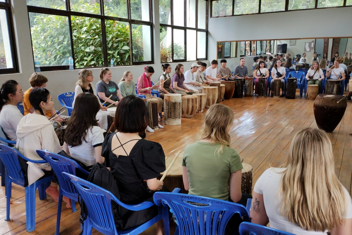 Students participating in a drum circle.