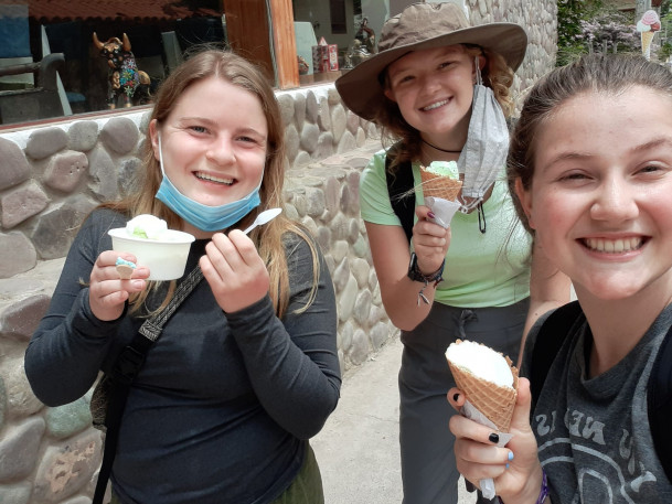 Students eating ice scream in the Ollantaytambo market square