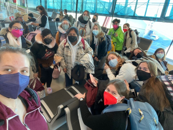 Students in the airport coming back to the United States