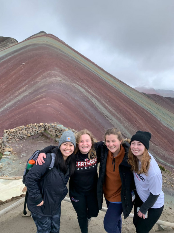 Group picture at the top of Rainbow Mountain in Vinicunca