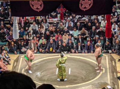 Students attend a Sumo tournament in Japan.