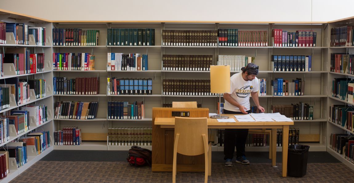 Students study and work on assignments in the library.