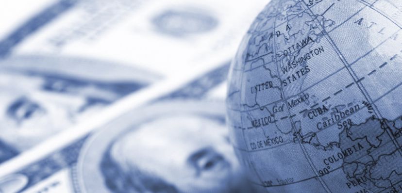 A globe and cash close up.