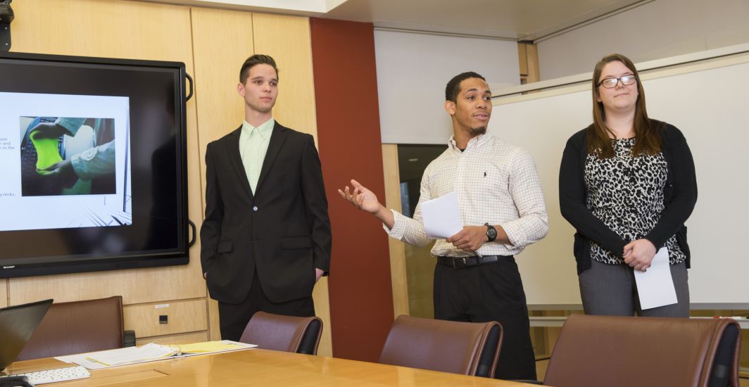 Students present a project in the Troha Boardroom in A. W. Clausen Center for World Business. 
