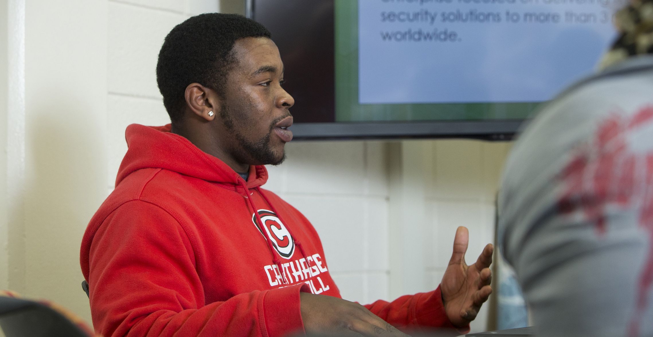 A communication major leads a discussion during a communication class.