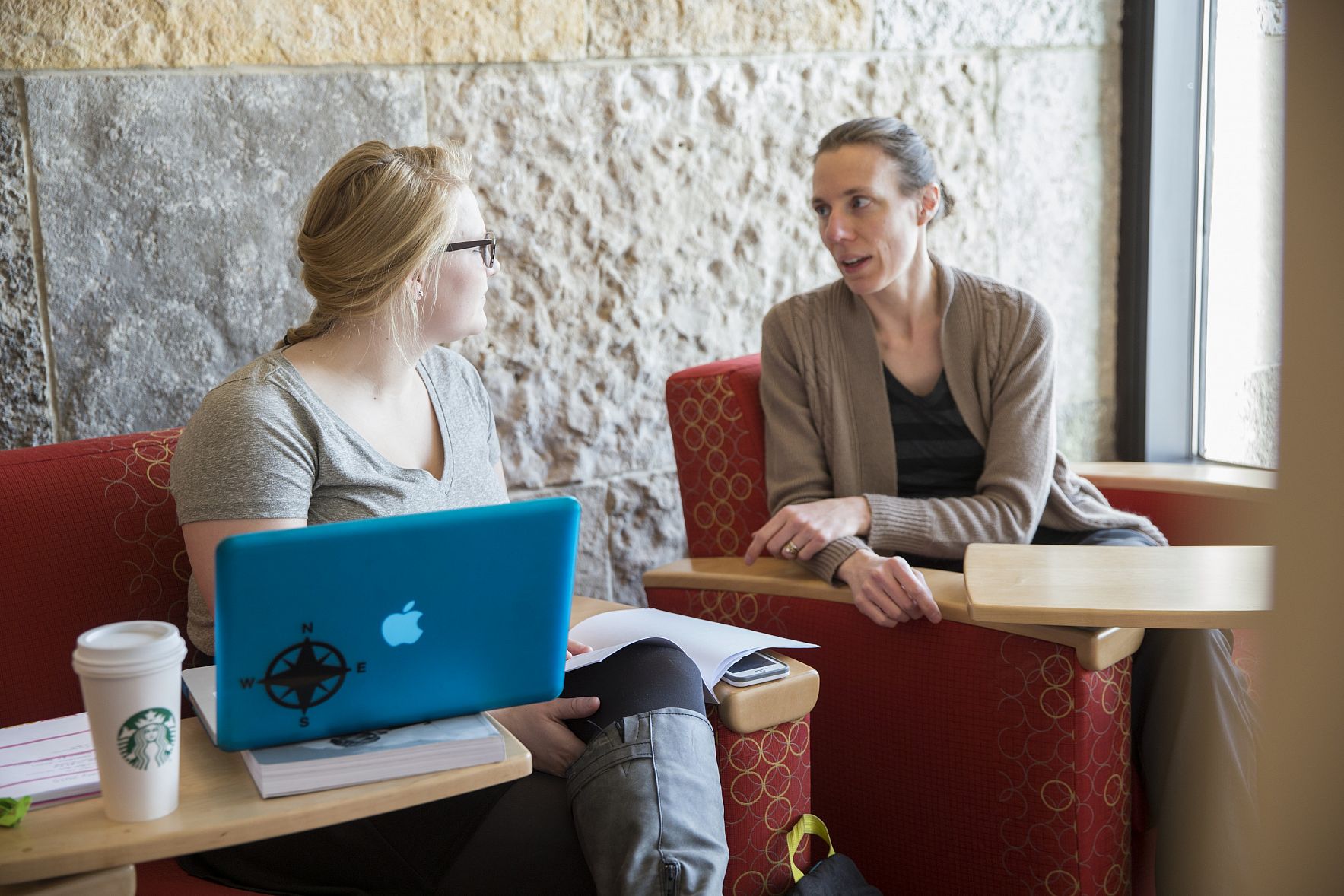 Professor Tracy Gartner meets with a student.