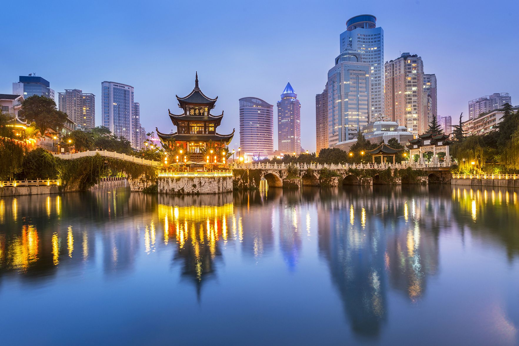 Cityscape of Guiyang at night, Jiaxiu Pavilion on the Nanming River. Located in Guiyang City, Guizhou Province, China.